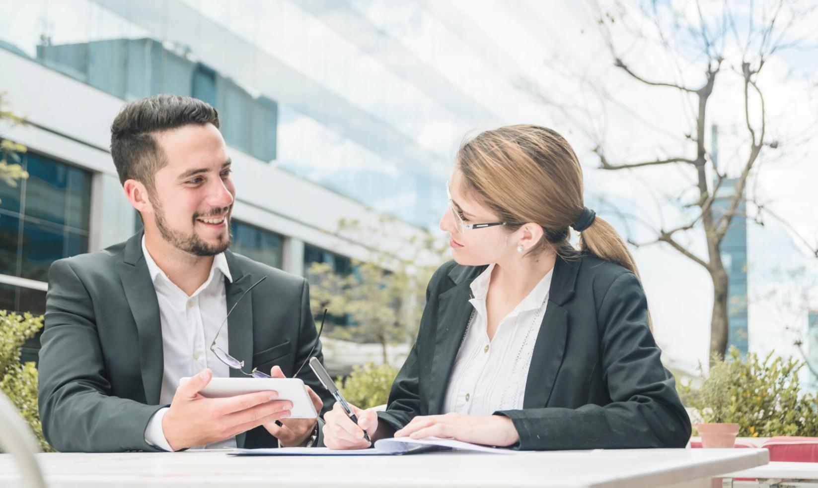 Instructor reviewing code implementation with student